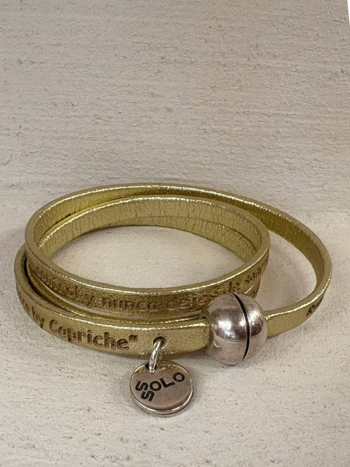 PULSERA "BAILEMOS" DORADO